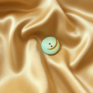 Vintage mintgroene knoop met gouden maan